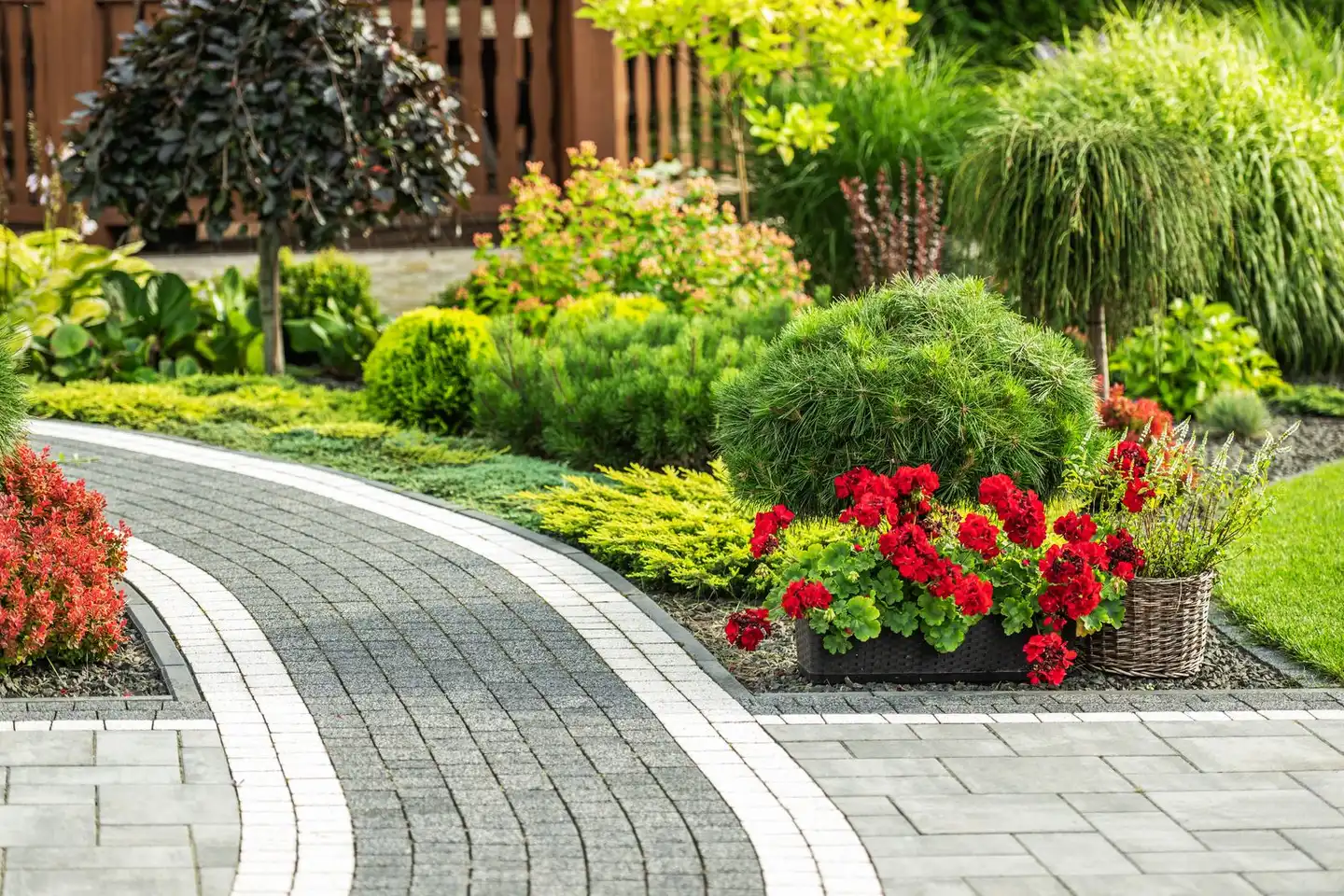 Hand-laid stone walkway approach with planted borders